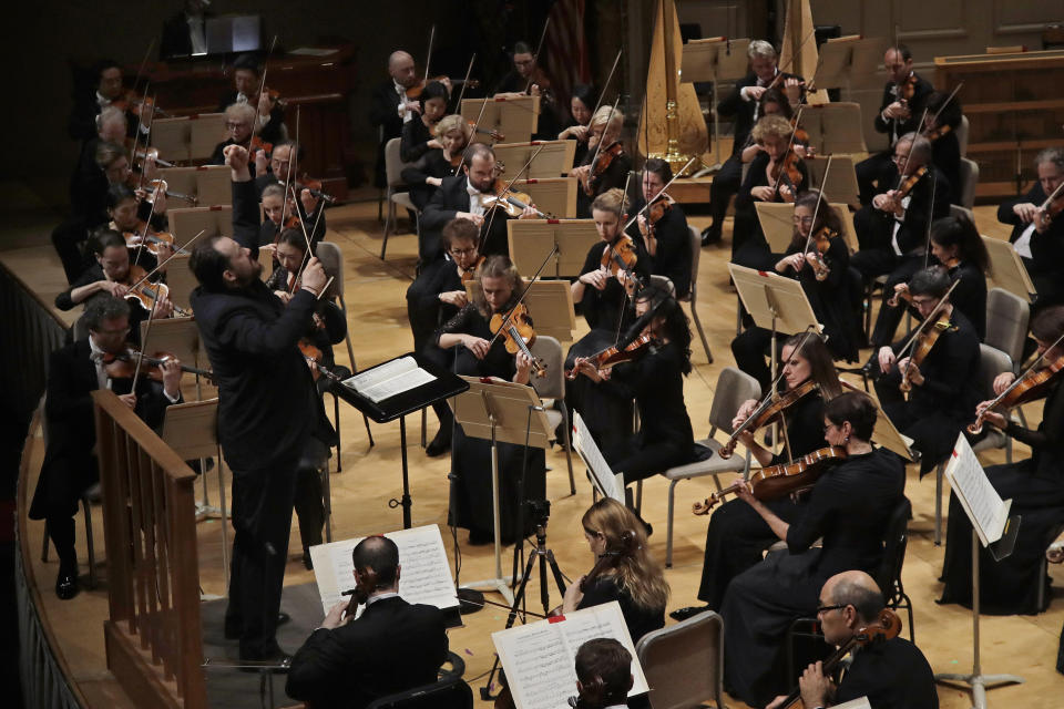 Andris Nelsons conducts a joint concert of the Boston Symphony Orchestra and Germany's visiting Leipzig Gewandhaus Orchestra, Thursday, Oct. 31, 2019, at Symphony Hall in Boston. (AP Photo/Elise Amendola)