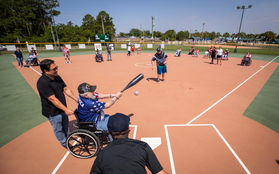 Army veteran Gary Gilltrap makes contact during the Clifford Sims State Veterans Nursing Home baseball game at Frank Brown Park on Tuesday.