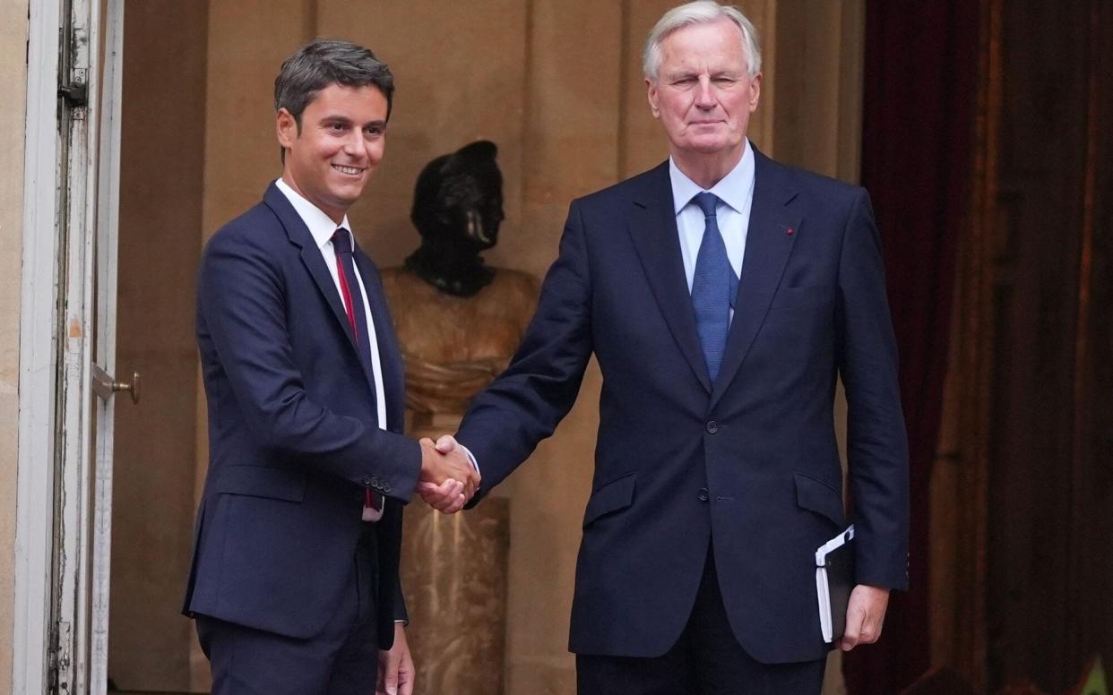 Gabriel Attal, France's outgoing prime minister, left, and Michel Barnier, France's incoming prime minister, on Thursday