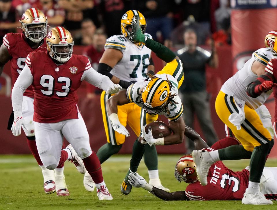 SANTA CLARA, CALIFORNIA - SEPTEMBER 26: Aaron Jones #33 of the Green Bay Packers rushes during the second half against the San Francisco 49ers in the game at Levi's Stadium on September 26, 2021 in Santa Clara, California.