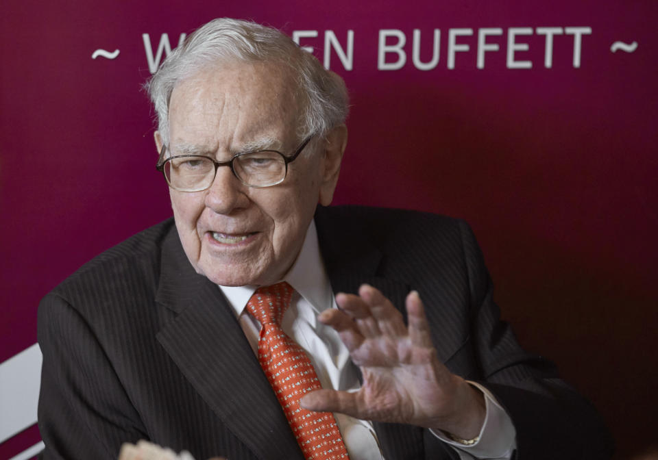 FILE - In this May 5, 2019, file photo, Warren Buffett, Chairman and CEO of Berkshire Hathaway, speaks during a game of bridge following the annual Berkshire Hathaway shareholders meeting in Omaha, Neb. Buffett's Berkshire Hathaway now controls nearly 20% of Occidental Petroleum's stock after picking up another $250 million worth of shares of the oil producer this week. Buffett has been buying stocks aggressively this year as the market fell, including investing more than $51 billion in the first quarter alone. (AP Photo/Nati Harnik, File)