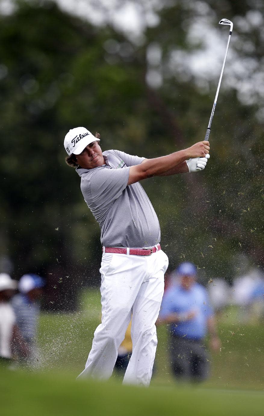 Jason Dufner hits from the fairway on the 17th hole during the first round of the Cadillac Championship golf tournament Thursday, March 6, 2014, in Doral, Fla. (AP Photo/Wilfredo Lee)