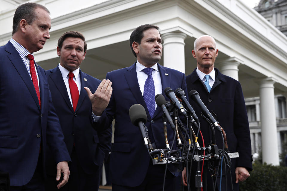 Left to right, Rep. Mario Diaz-Balart, Gov. Ron DeSantis, Sen. Marco Rubio and Sen. Rick Scott, all Republicans from Florida, speak to the media outside the White House after meeting with President Donald Trump about Venezuela on Jan. 22, 2019.