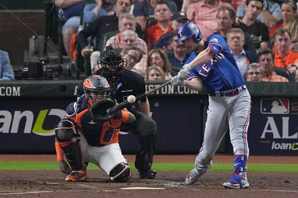 Texas Rangers’ Mitch Garver hits a home run during the second inning of Game 6 of the baseball AL Championship Series on Sunday.