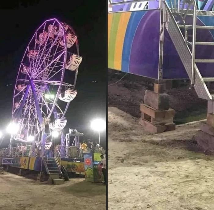 A ferris wheel held up by bricks