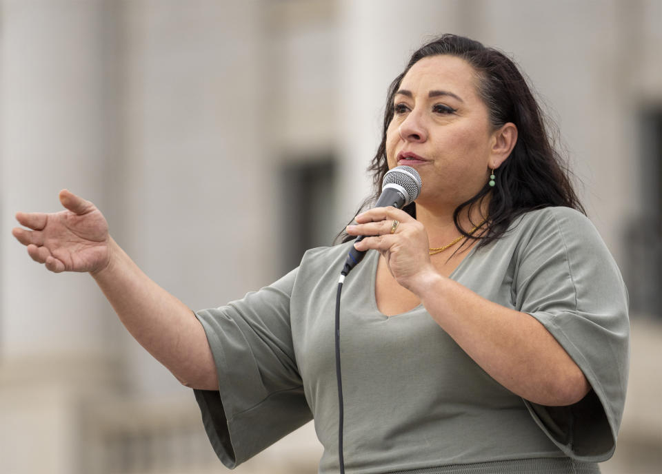 FILE - Rep. Angela Romero speaks on the steps of the state Capitol, during a rally to gain support for removing the clergy exemption from mandatory reporting in cases of abuse and neglect, on Friday, Aug. 19, 2022, in Salt Lake City. (Rick Egan/The Salt Lake Tribune via AP, File)