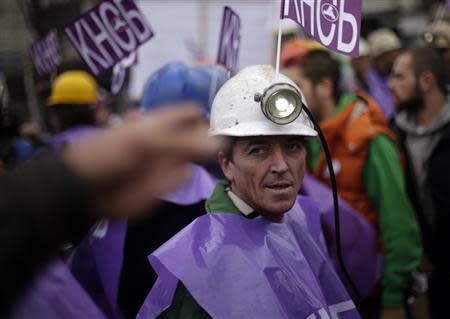 A miner participates in a demonstration in front of the parliament in Sofia November 20, 2013. REUTERS/Stoyan Nenov