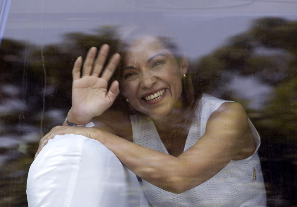 FILE - In this Friday March 30, 2012 file photo, Josefina Vazquez Mota, presidential candidate for the now-governing National Action Party, PAN, waves to supporters through a car window in Mexico City. Mexicans hoped that their country would take a new course under Vicente Fox's center-right National Action Party, or PAN, but despite a more open economy and a bigger middle class, Mexico is torn by drug trafficking violence after a dozen years under the PAN's leadership, first under Fox and then under current President Felipe Calderon, who barely squeaked by in contested 2006 elections. (AP Photo/Eduardo Verdugo, File)