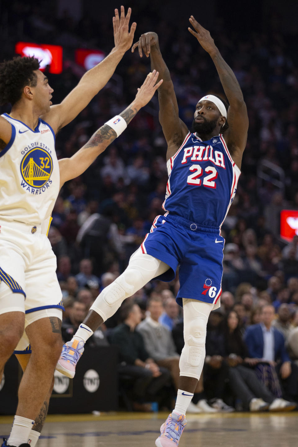 Philadelphia 76ers guard Patrick Beverly (22) shoots over Golden State Warriors forward Trayce Jackson-Davis (32) during the first half of an NBA basketball game, Tuesday, Jan. 30, 2024, in San Francisco. (AP Photo/D. Ross Cameron)