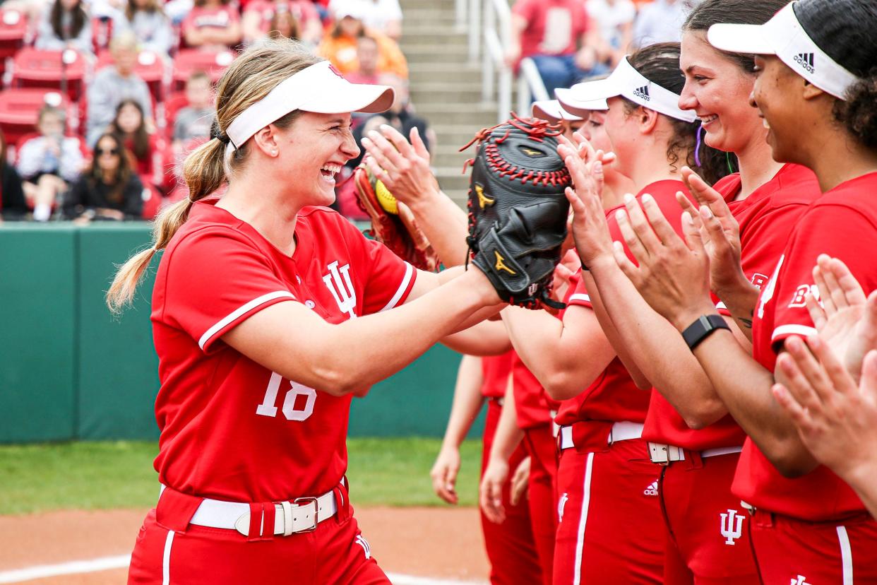 Indiana softball player Brittany Ford is congratulated by her teammates during the game between Illinois i and the Hoosiers at Andy Mohr Field in Bloomington on April 30, 2022.
