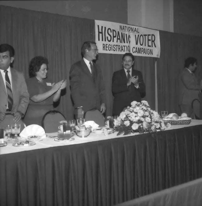 Voter registration leader Willie Velasquez at an event with future President George H.W. Bush.