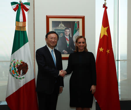 Mexico's Foreign Minister Claudia Ruiz Massieu shakes hands with Chinese State Councillor Yang Jiechi after attending a private meeting at the foreign ministry building (SRE), in Mexico City in this undated handout photo released to Reuters by the Mexican Foreign Ministry office on December 12, 2016. Mexico's Foreign Ministry office/Handout via REUTERS