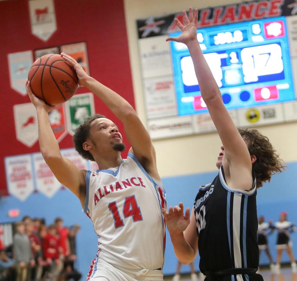 Alliance's Jayce Crockett, left, puts up a shot defended by Louisville's Tate Aljancic, Tuesday, Dec. 12, 2023.