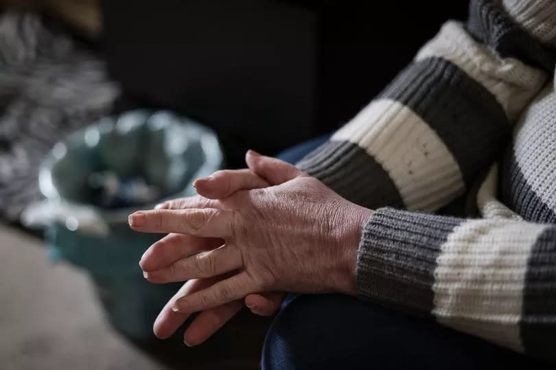 Hands of Moira Leavy in her home she will soon be evicted from