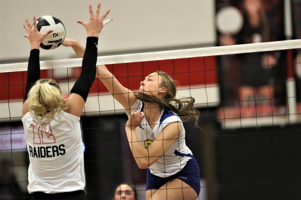 Muncie Burris volleyball's Lilly Howell gets a kill in the team's sectional championship match against Wapahani at Wapahani High School on Saturday, Oct. 15, 2022.