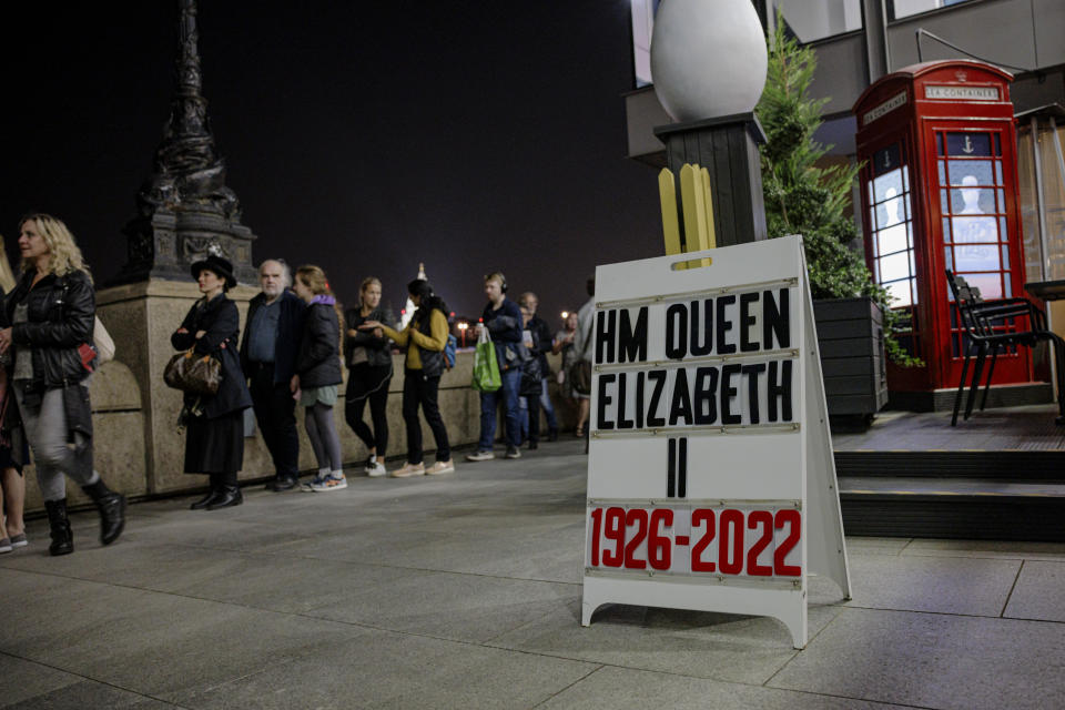 LONDON, ENGLAND - SEPTEMBER 14: A sandwich board displaying the years of Queen Elizabeth II's life is seen on Southbank as tens of thousands join queues to see Queen Elizabeth II lying in state at Westminster Hall on September 14, 2022 in London, England. Elizabeth Alexandra Mary Windsor was born in Bruton Street, Mayfair, London on 21 April 1926. She married Prince Philip in 1947 and acceded to the throne of the United Kingdom and Commonwealth on 6 February 1952 after the death of her Father, King George VI. Queen Elizabeth II died at Balmoral Castle in Scotland on September 8, 2022, and is succeeded by her eldest son, King Charles III. (Photo by Rob Pinney/Getty Images)