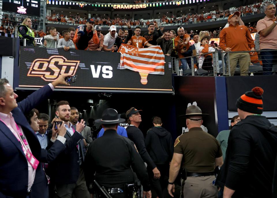 Oklahoma State football head coach Mike Gundy walks of the field following the Big 12 Football Championship game between the Oklahoma State University Cowboys and the Texas Longhorns at the AT&T Stadium in Arlington, Texas, Saturday, Dec. 2, 2023.