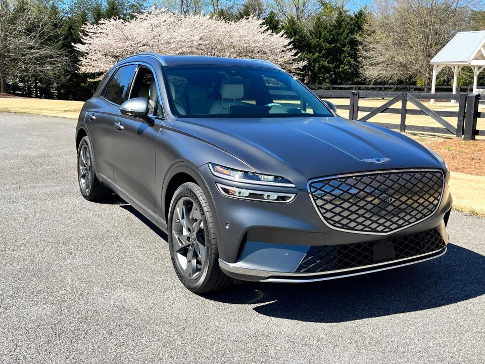 The 2023 Genesis GV70 EV SUV's solid grille is  one of its few visual differences from gasoline-burning GV70s.