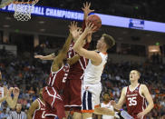 Virginia's Kyle Guy (5) shoots while defended by Oklahoma's Aaron Calixte (2) and Matt Freeman (5) during the second half of a second round men's college basketball game in the NCAA Tournament in Columbia, S.C. Sunday, March 24, 2019. (AP Photo/Richard Shiro)