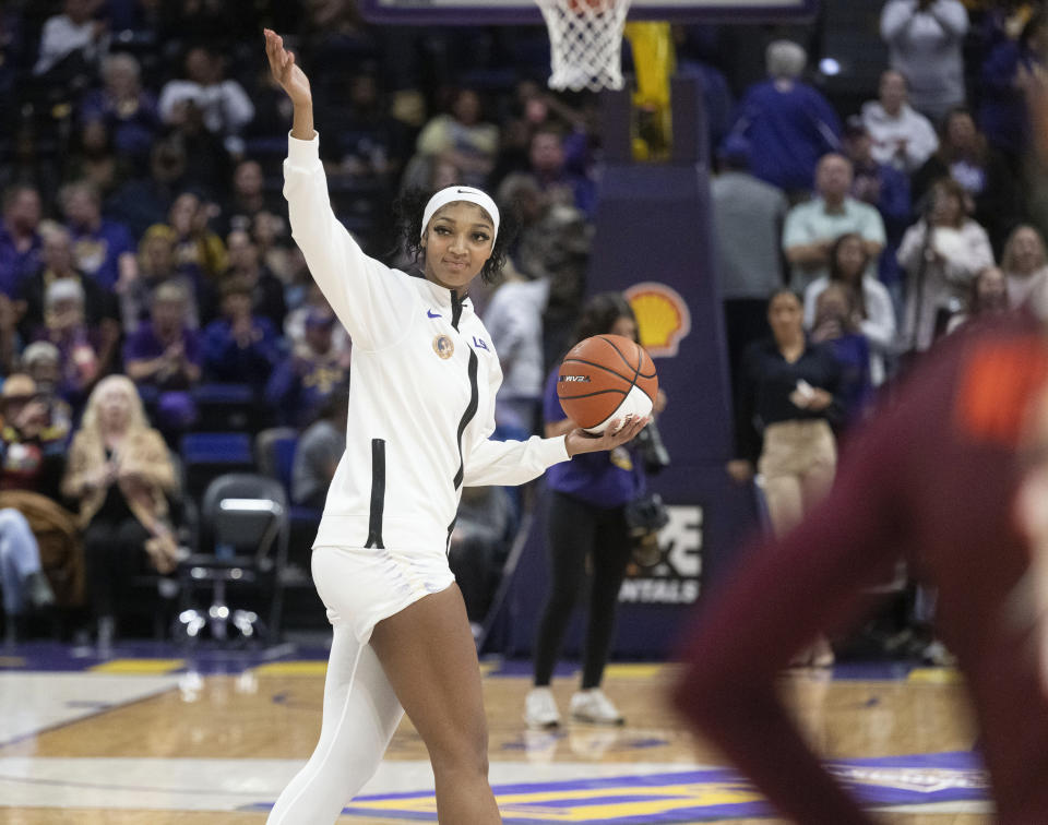 LSU forward Angel Reese (10) is recognized for 1,000 career rebounds, before the team's NCAA college basketball game against Virginia Tech on Thursday, Nov. 30, 2023, in Baton Rouge, La. (Hilary Scheinuk/The Advocate via AP)