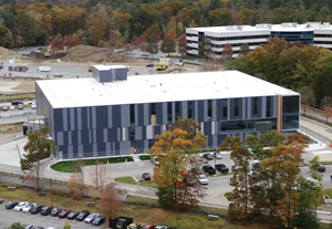 The exterior panels on Ultragenyx's new gene therapy manufacturing facility in Bedford, Massachusetts are a representation of the sequenced human genome.