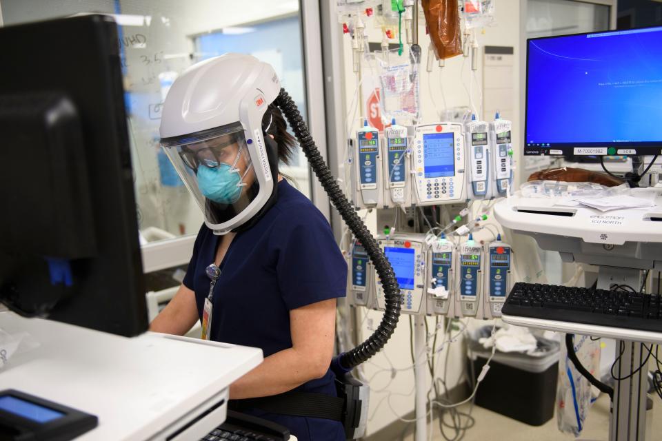 A nurse wearing personal protective equipment (PPE) including a personal air purifying respirator as her LA hospital reaches Covid capacity. Source: Getty