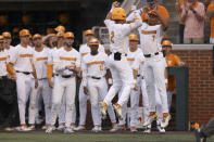 Tennessee's Jorel Ortega (2) celebrates with Christian Moore (7) after hitting a home run in the sixth inning during an NCAA college baseball super regional game against Notre Dame, Friday, June 10, 2022, in Knoxville, Tenn. (AP Photo/Randy Sartin)