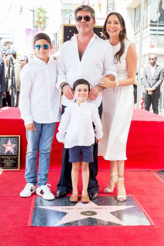 Rich Fury/Getty Simon Cowell and Lauren Silverman with their kids