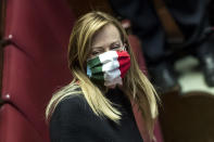 Leader of Fratelli d'Italia (Brothers of Italy) party, Giorgia Meloni, wears a mask in the colors of the Italian flag as she attends a session of the Italian Parliament in Rome, Thursday, April 16, 2020. Italy’s hardest-hit region of Lombardy is pushing to relaunch manufacturing on May 4, the day that the national lockdown is set to lift. Lombardy’s plan focuses on maintaining a one-meter distance between workers, mandating the use of masks, mobile working where possible and the use of anti-body blood testing, which is set to launch in the region on April 21, to get a better picture of where the virus is still active. (Roberto Monaldo/LaPresse via AP)