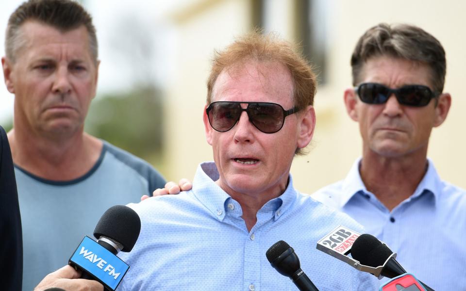 Ricki Grimmer, (centre), along with brothers Stephen, (left), and Paul, (right) address the media following a new development in the disappearance of their sister Cheryl  - Credit: AAP