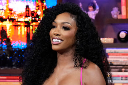 Porsha Williams smiling while at Watch What Happens Live.