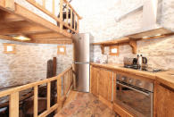 <p>The rounded walls of the tower make for a unique, open-concept kitchen space. (Airbnb) </p>