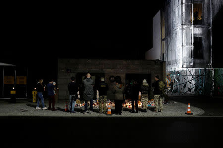 People pray as they protest in support of Alfie Evans, in front of the British Embassy building in Warsaw, Poland April 26, 2018. REUTERS/Kacper Pempel