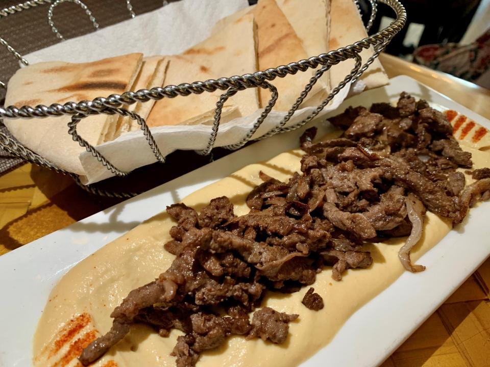 Aya Mediterranean Cuisine in downtown Melbourne has fine hummus, of smooth consistency, topped with thin strips of beef shawarma lent flavor by its marinade and a few stray bits of onion. .
