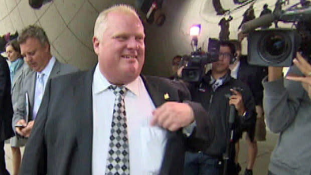 Toronto Mayor Rob Ford speaks to reporters in front of the Cloud Gate sculpture at Chicago's Millenium Park on Tuesday.