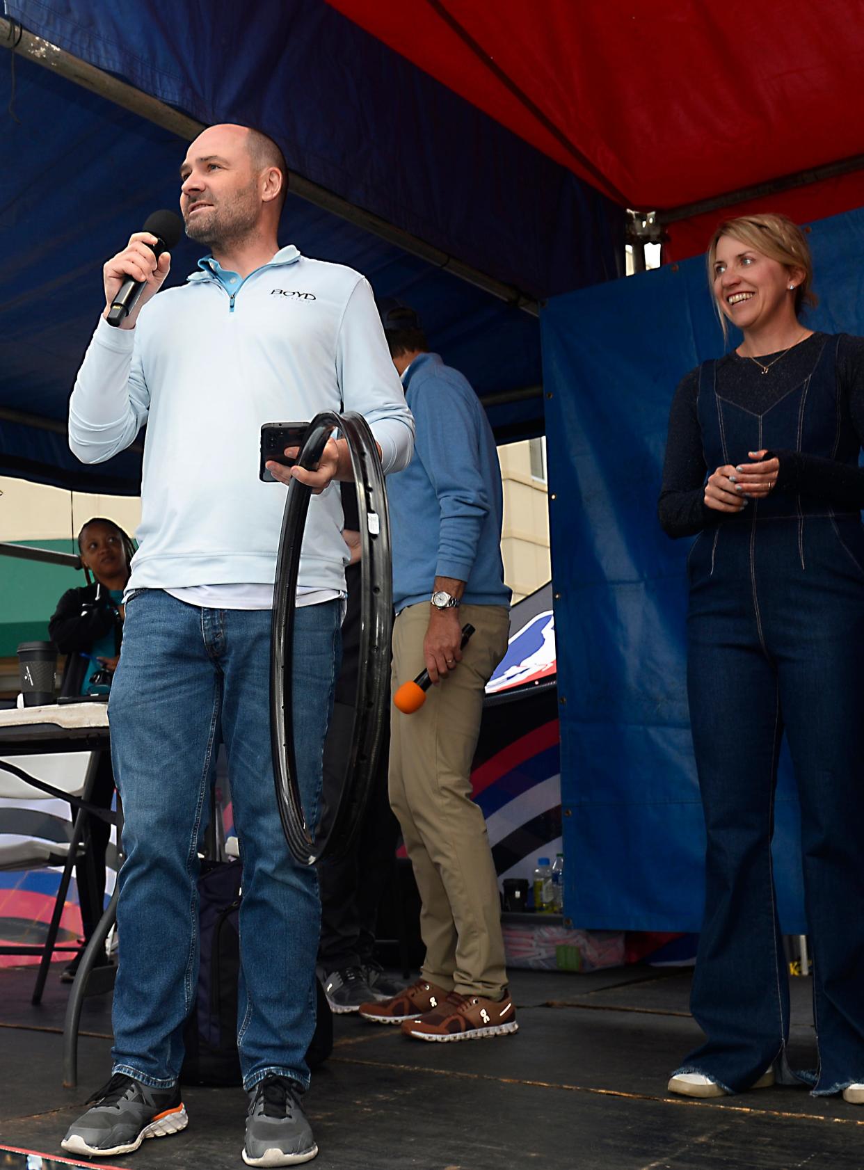 Boyd and Nicole Johnson of Boyd Cycling company make the announcement that their company is coming to Landrum at the bike races at Spring Fling in Spartanburg on April 26, 2024.