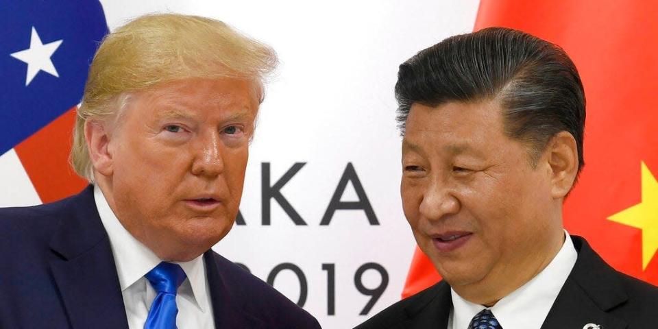 In this June 29, 2019, file photo, U.S. President Donald Trump poses for a photo with Chinese President Xi Jinping during a meeting on the sidelines of the G-20 summit in Osaka, western Japan.