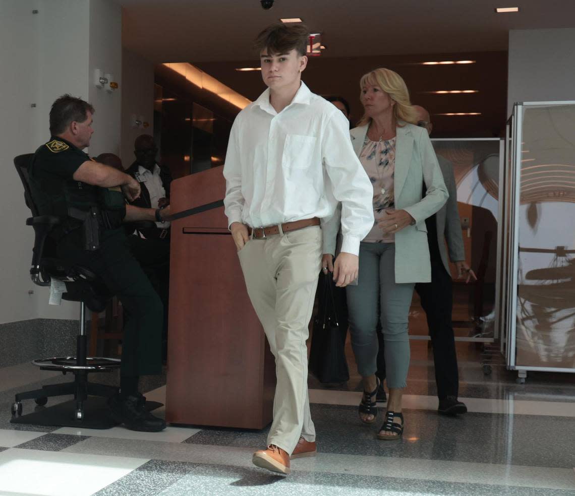 POOL: On Tuesday, July 19, 2022, a young man and family members walk into the courtroom after being summoned into court on the second day of the sentencing trial for convicted Parkland school shooter Nikolas Cruz at the Broward County Judicial Complex in downtown Fort Lauderdale, Florida.