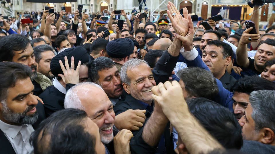 Newly-elected Iranian President Masoud Pezeshkian is cheered by supporters as he arrives at the shrine of the Islamic Republic's founder Ayatollah Ruhollah Khomeini in Tehran on July 6, 2024. - Atta Kenare/AFP/Getty Images