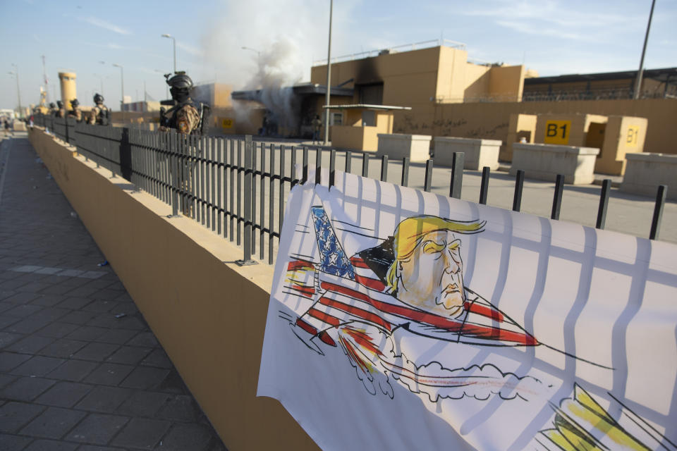 Iraqi army soldiers are deployed in front of the U.S. embassy, in Baghdad, Iraq, Wednesday, Jan. 1, 2020. Iran-backed militia have withdrawn from the U.S. Embassy compound in Baghdad after two days of clashes with American security forces. (AP Photo/Nasser Nasser)