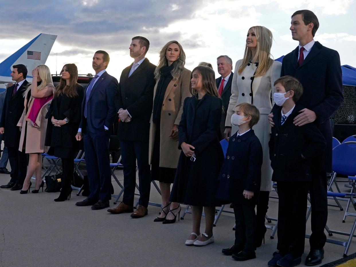 Ivanka Trump (2nd R), husband Jared Kushner (R), their children, Eric (C-R) and Donald Jr. (C-R) and Trump family members stand on the tarmac at Joint Base Andrews in Maryland as they arrive for US President Donald Trump's departure on January 20, 2021.