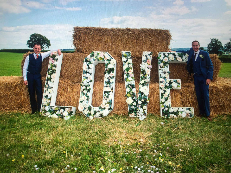 Ashley Jenkins (left) and Callum Hodge on their wedding day. See SWNS story SWOCletter. Police are investigating after a gay couple about marry were sent a poison pen letter from someone in their village - warning the reception should be held elsewhere. Callum Hodge and Ashley Jenkins announced their engagement and received nothing but love and support from friends and family. But little did they know that some people in Callums home of Norton Malreward in Somerset - population just 246 - were plotting to ruin their special day. Four months before the wedding reception held at Callums parents' private barn conversion, his mum Janie - a post lady - received a letter.  