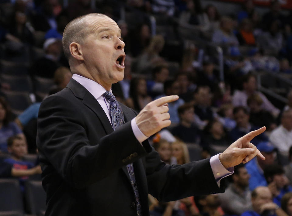 Sacramento Kings head coach Michael Malone directs his team in the fourth quarter of an NBA basketball game against the Oklahoma City Thunder in Oklahoma City, Sunday, Jan. 19, 2014. Oklahoma City won 108-93. (AP Photo/Sue Ogrocki)