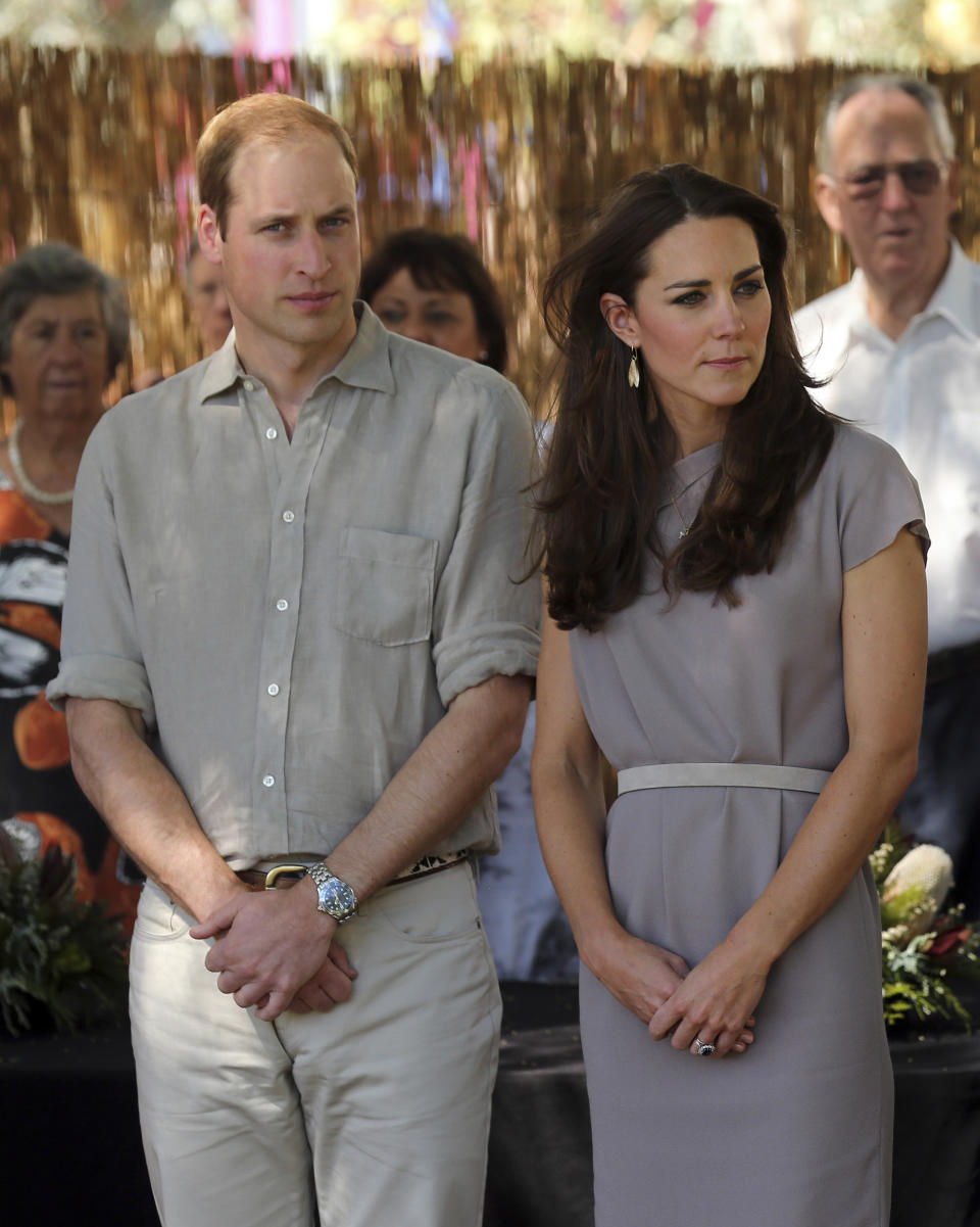 Britain's Prince William, left, and Kate, the Duchess of Cambridge, arrive at the National Indigenous Training Academy at Yulara, near Uluru, Australia, Tuesday, April 22, 2014. (AP Photo/Rob Griffith)