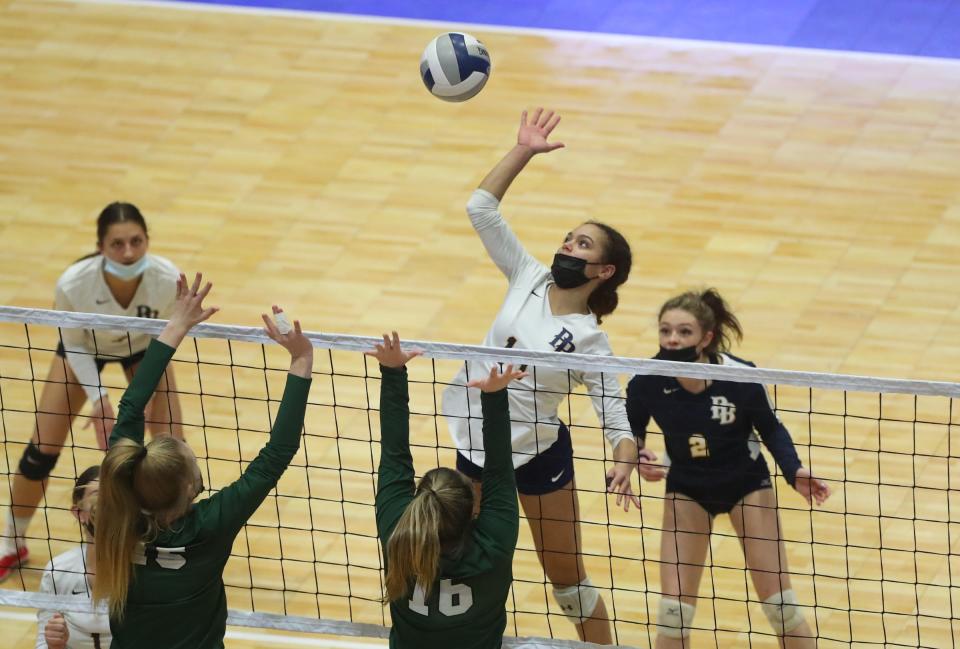 Pine Bush's Sienna Hunter (11) with a shot during the opening round of pool play in the NYSPHSAA girls volleyball championships at Cool Insuring Arena in Glens Falls on Saturday, November 20, 2021.
