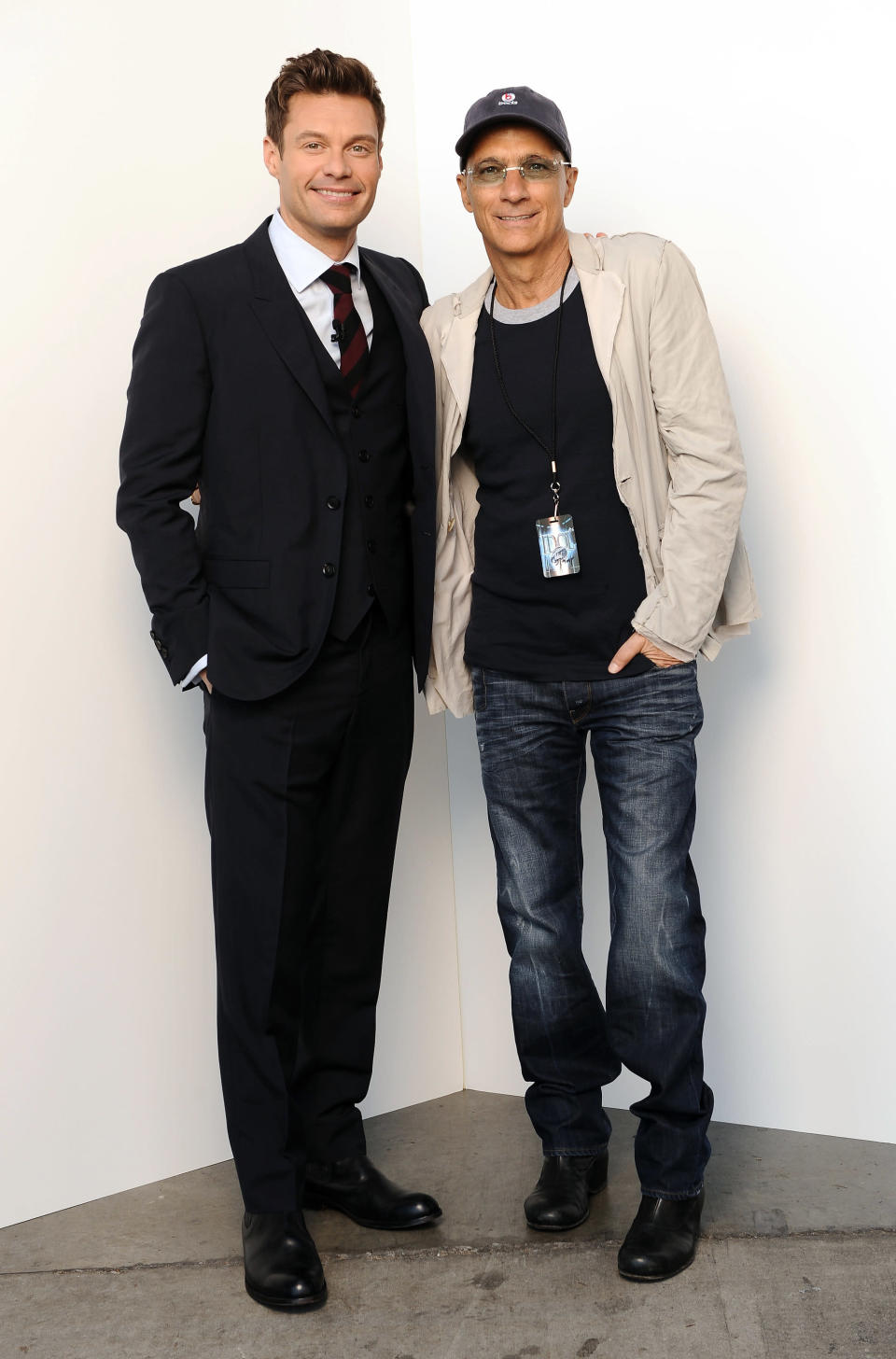 Host Ryan Seacrest (L) and music producer/mentor Jimmy Iovine backstage at FOX's 'American Idol' Season 11 Top 10 To 9 Live Elimination Show on March 22, 2012 in Hollywood, California. (Photo by FOX via Getty Images)