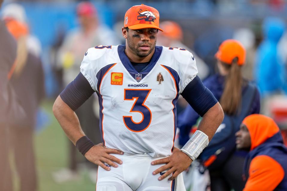 Denver Broncos quarterback Russell Wilson (3) watches as the closing seconds tick away during the second half against the Carolina Panthers at Bank of America Stadium.