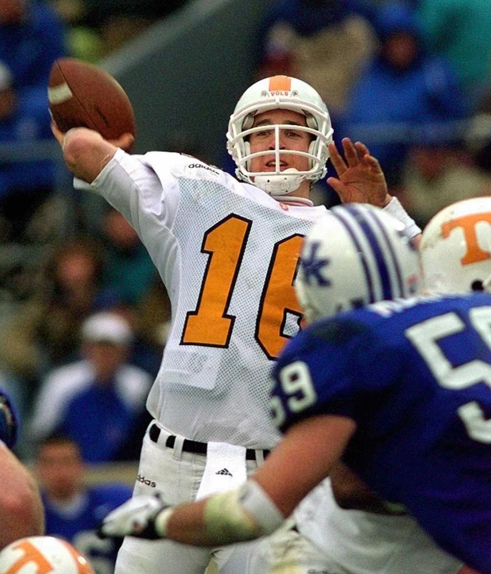 FILE - In this Nov. 22, 1997, file photo, Tennessee quarterback Peyton Manning launches a pass during the second half of his team's 59-31 win over Kentucky in an NCAA college football game in Lexington, Ky. Manning and his Southeastern Conference nemesis, former Florida coach Steve Spurrier, will go into the College Football Hall of Fame together. Manning started for four season at Tennessee and set school records for yards passing (11,201) and touchdown passes (89). (AP Photo/Ed Reinke, File)