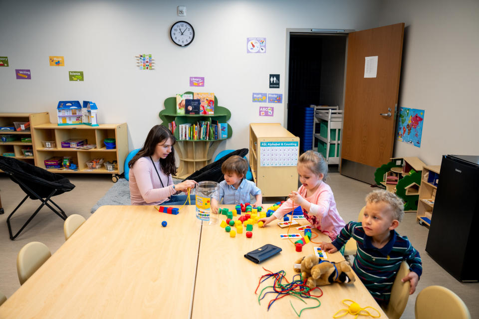  Children work with a staff member at Stepping Stones Tooele, a daycare that shares a campus with Harris Housing and Switchpoint Tooele Community Resource Center in Tooele on Friday, May 24, 2024. (Photo by Spenser Heaps for Utah News Dispatch)