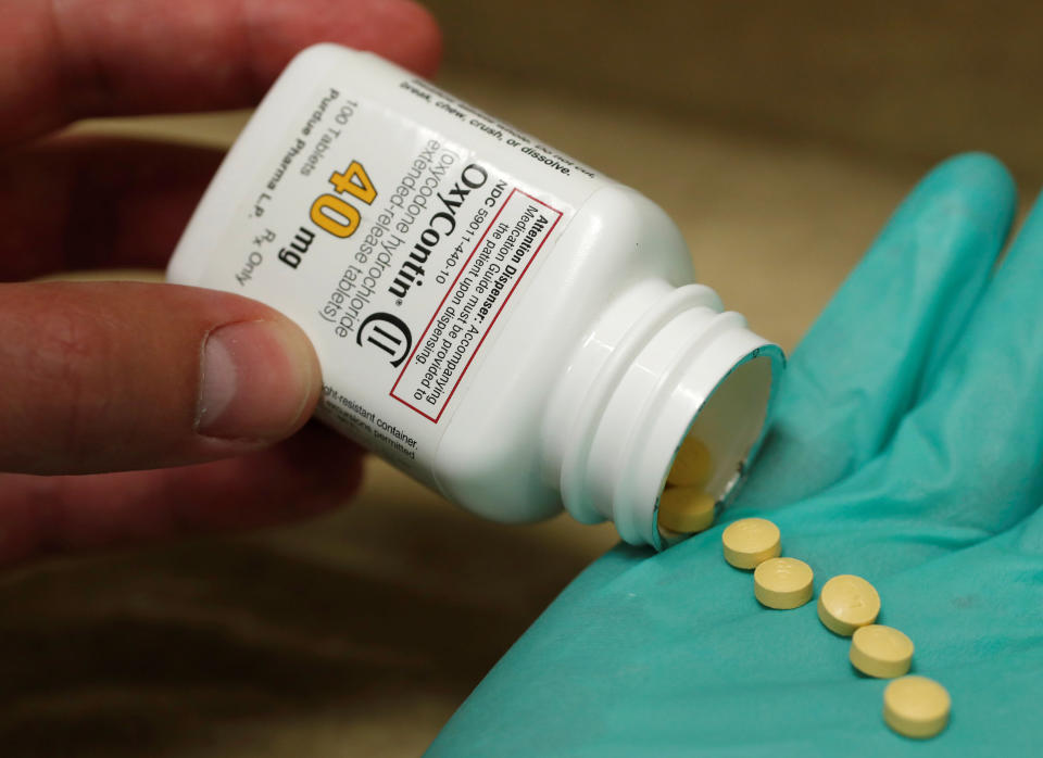 A pharmacist holds prescription painkiller OxyContin, 40mg pills, made by Purdue Pharma L.D. at a local pharmacy, in Provo, Utah, U.S., April 25, 2017. REUTERS/George Frey